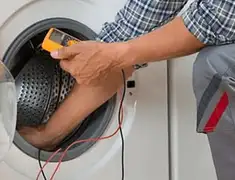Washing machine repair technician testing a front-load washer with diagnostic tools in San Jose, CA
